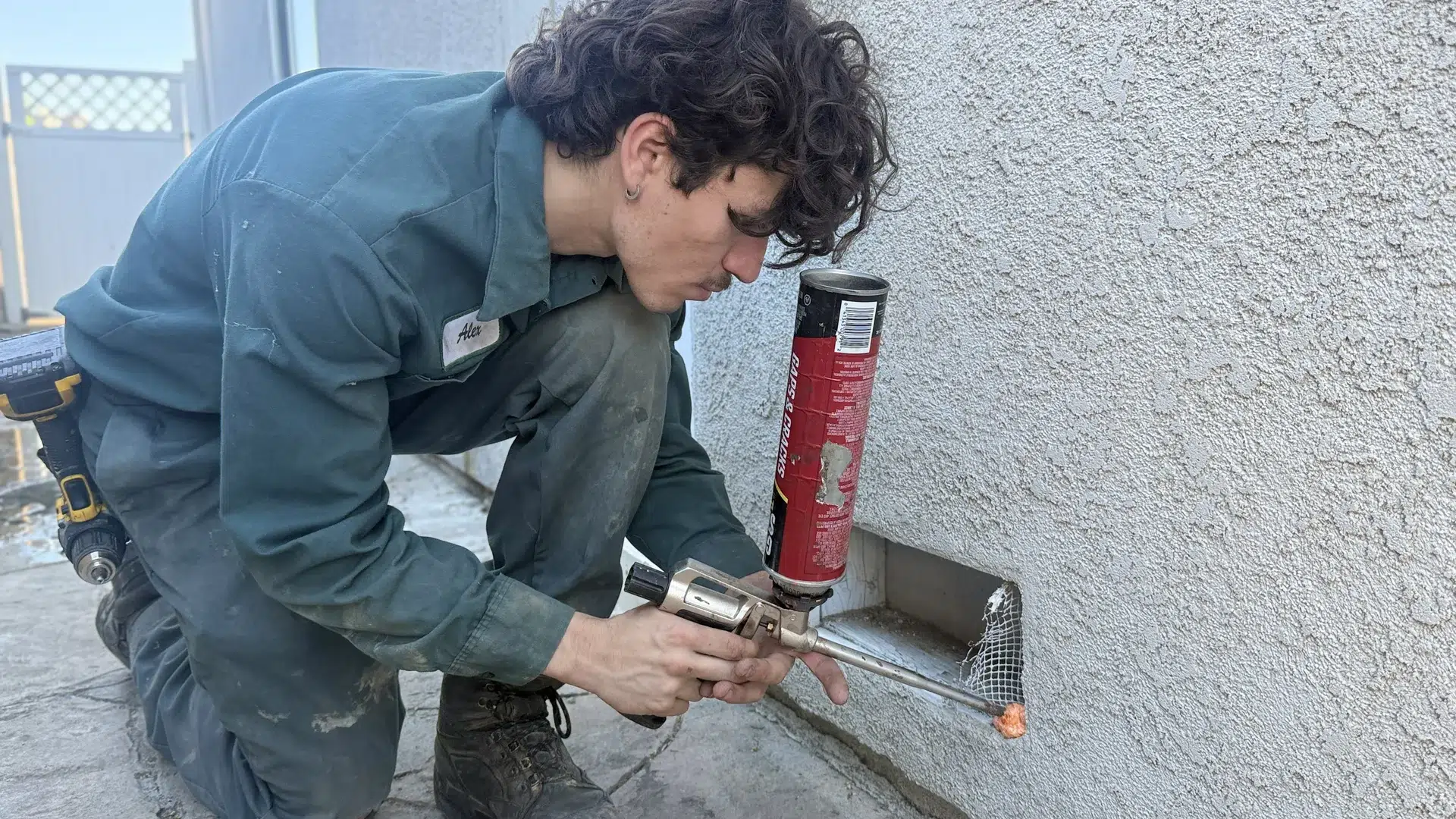 Treebark Los Angeles technician inspecting a residential wall for pest activity