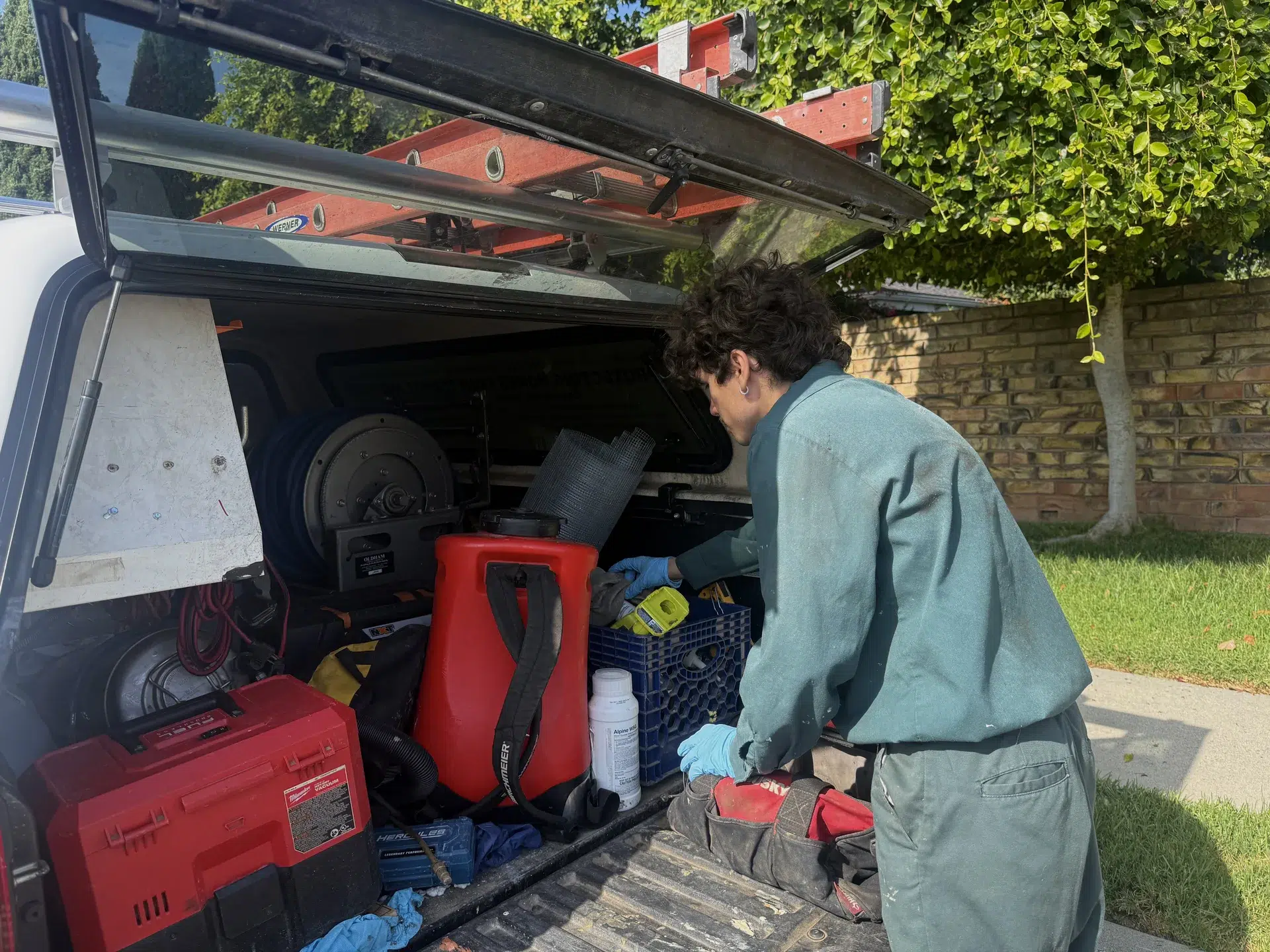 Fountain Valley termite technician loading treatment equipment