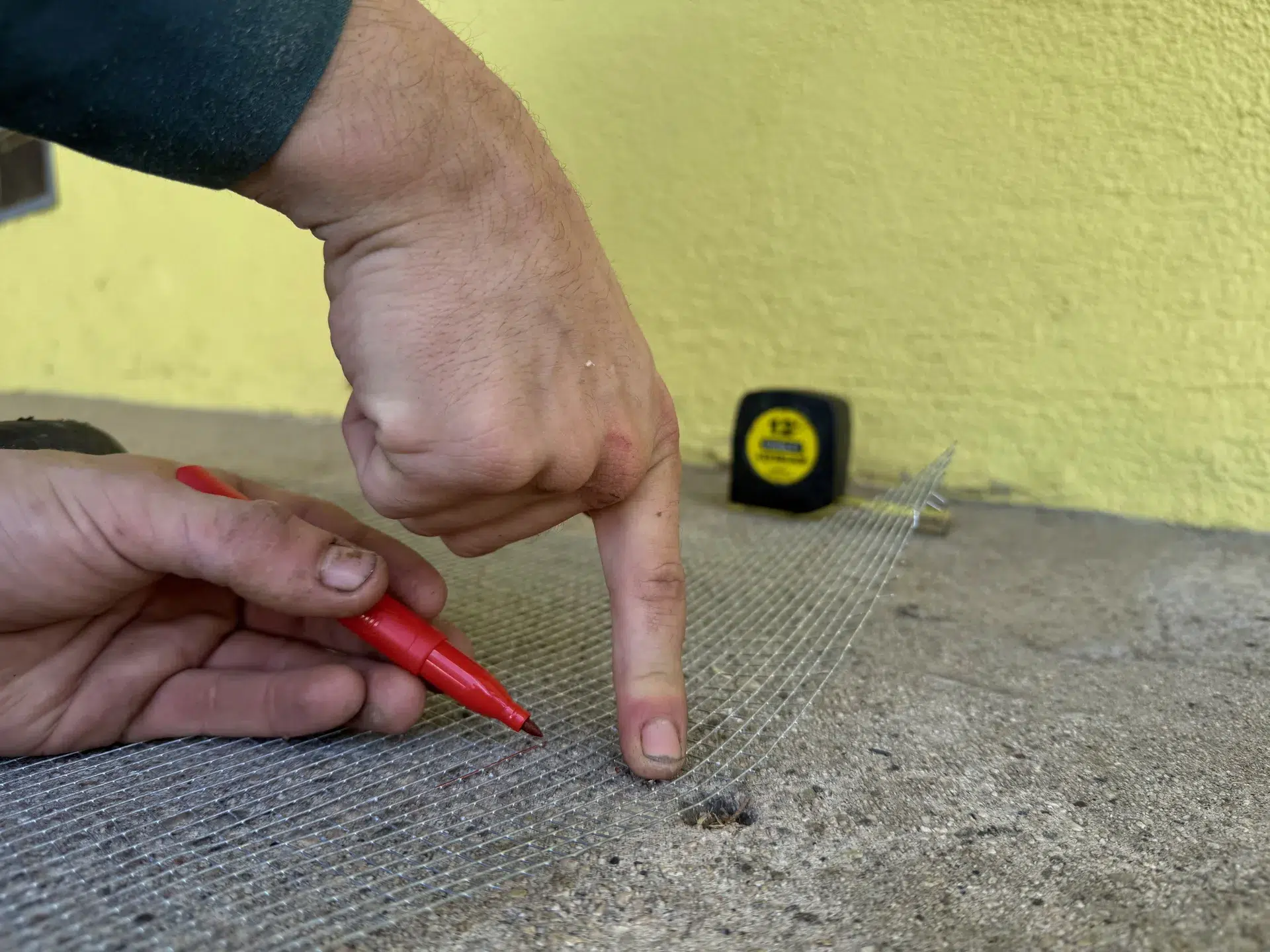 Fountain Valley termite inspection measuring a concrete entry