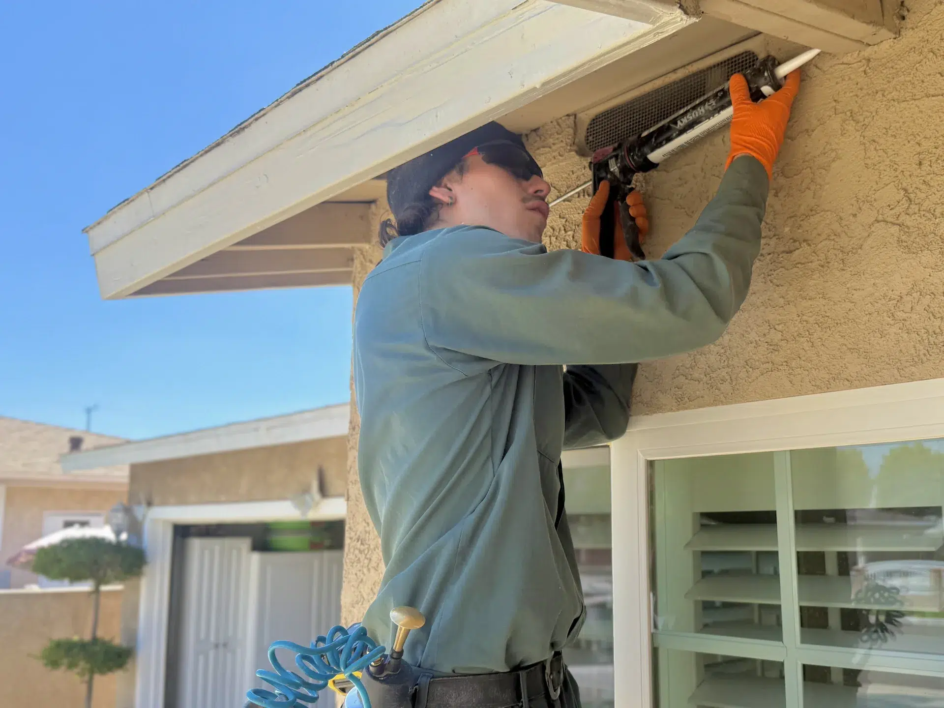 Treebark technician sealing a Redondo Beach eaves entry point