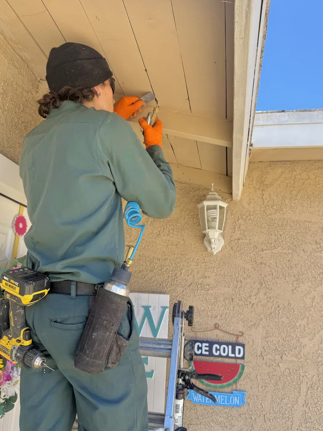 Fountain Valley termite technician treating porch eavestreating a Fountain Valley porch eave